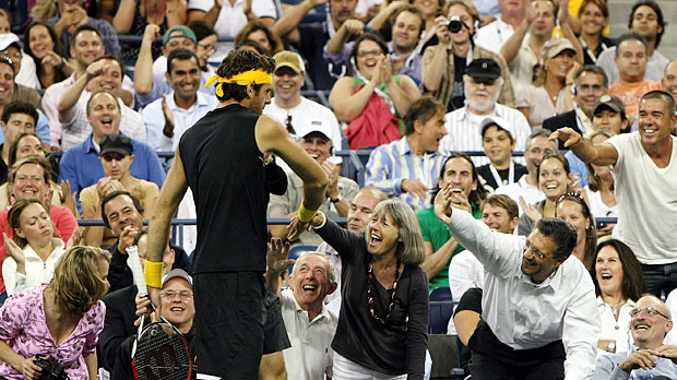 Juan Martin Del Potro gives high fives to the crowd at the US Open. 