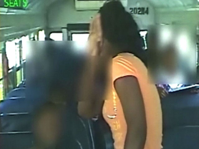 Caught on tape: Woman slaps kid on school bus - CBS News