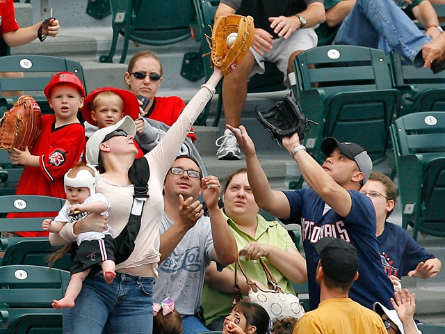 Dad With Baby Strapped To Chest Holding Beer Catches Foul Ball At