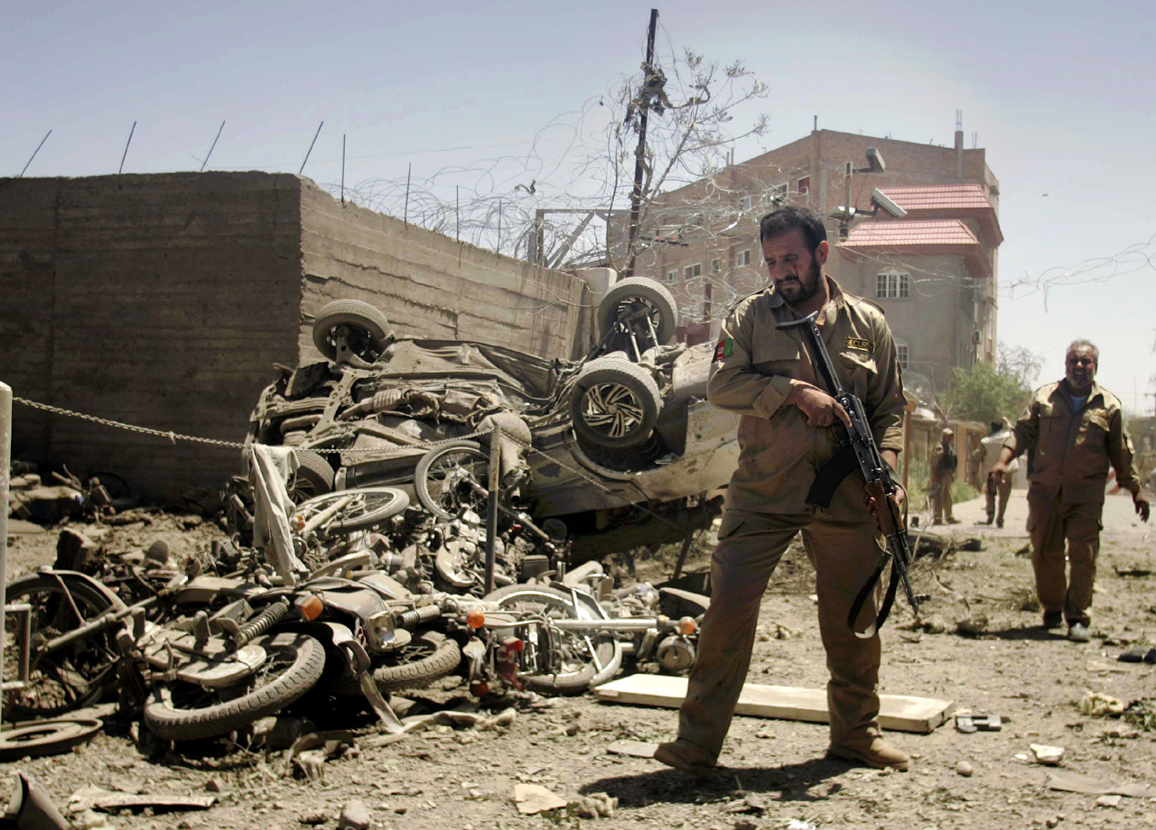 Afghan militants, suicide bombs attack NATO - CBS News