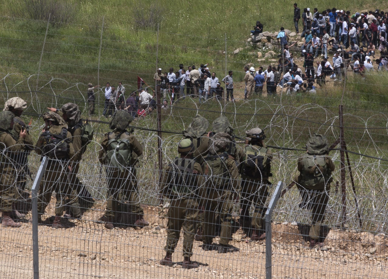 20 Die As Israeli Troops Fire Along Syria Border - CBS News