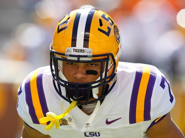 Tyrann Mathieu LSU Tigers Unsigned White Jersey Fumble Recovery Photograph