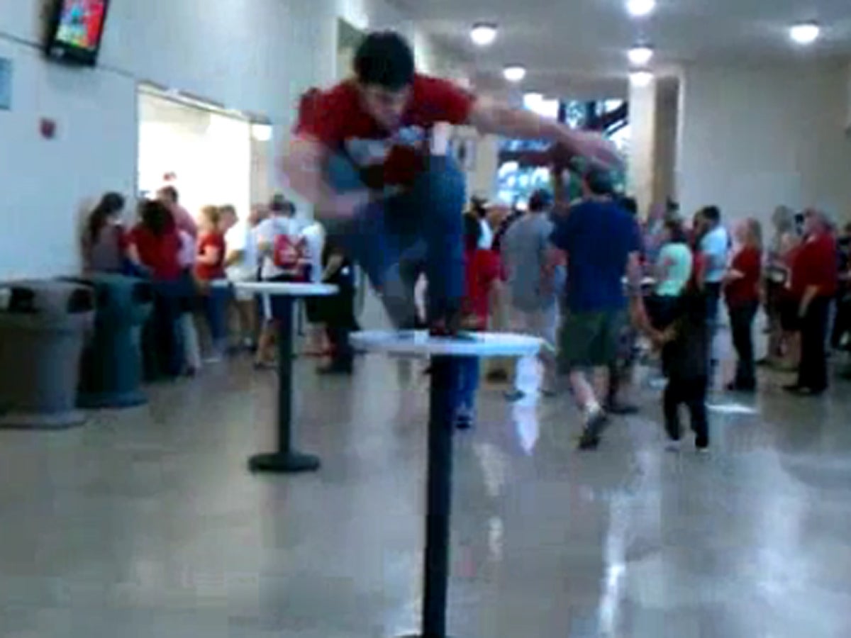 Guy attempts to jump over table, fails miserably CBS News