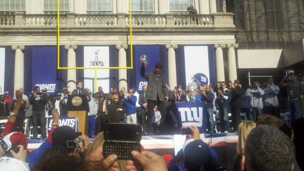 eli-with-the-championship-trophy.jpg 