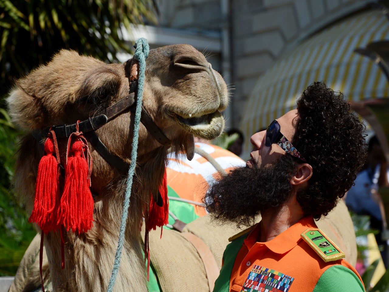 "The Dictator" Sacha Baron Cohen enters Cannes on a camel CBS News(02)