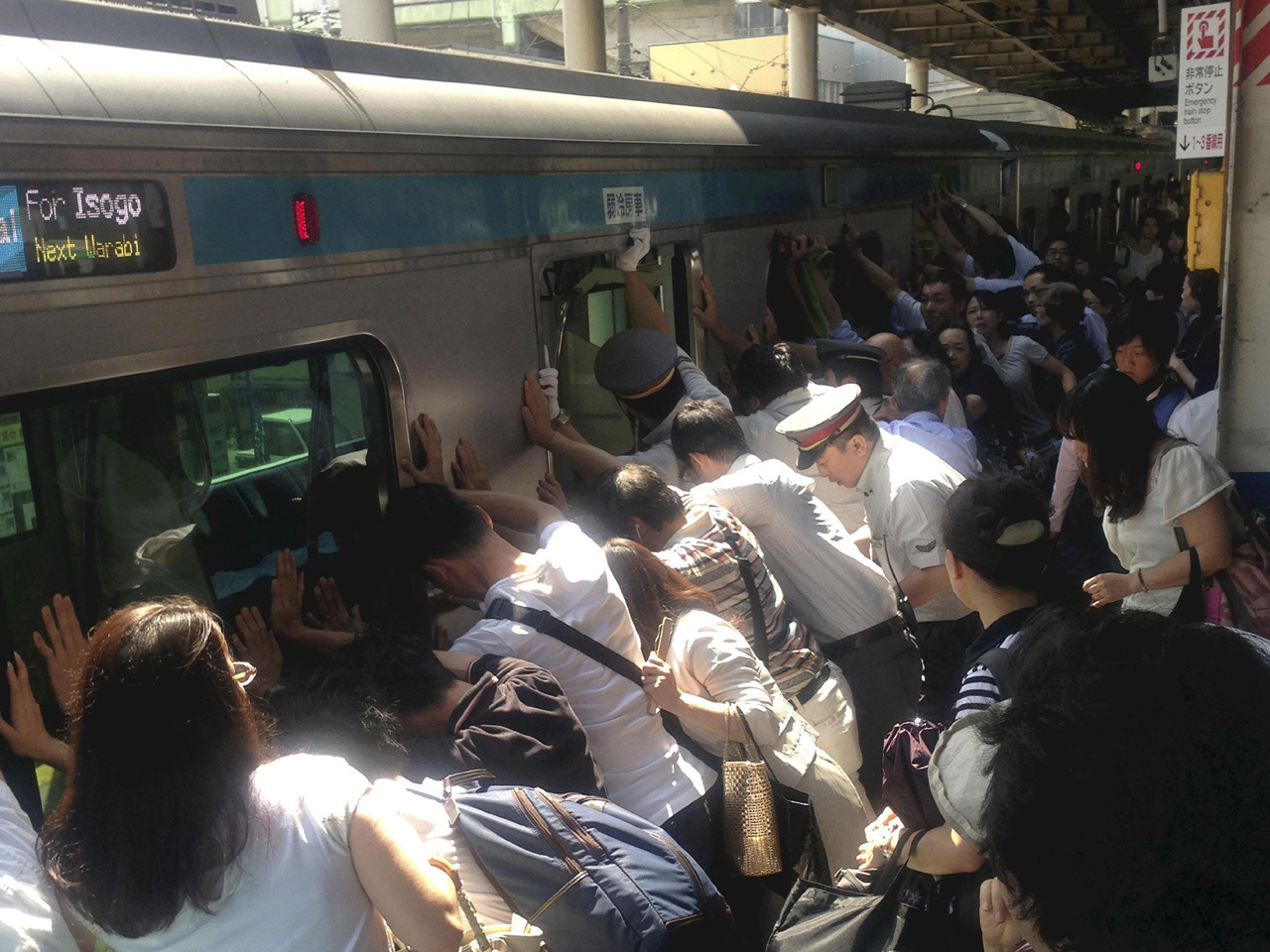 Japanese Commuters Push Ton Train To Free Woman CBS News