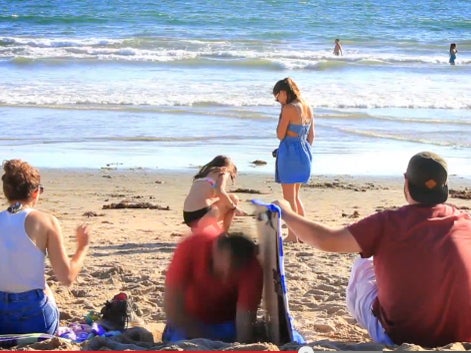Disappearing man on beach prank! Where'd he go? - CBS News