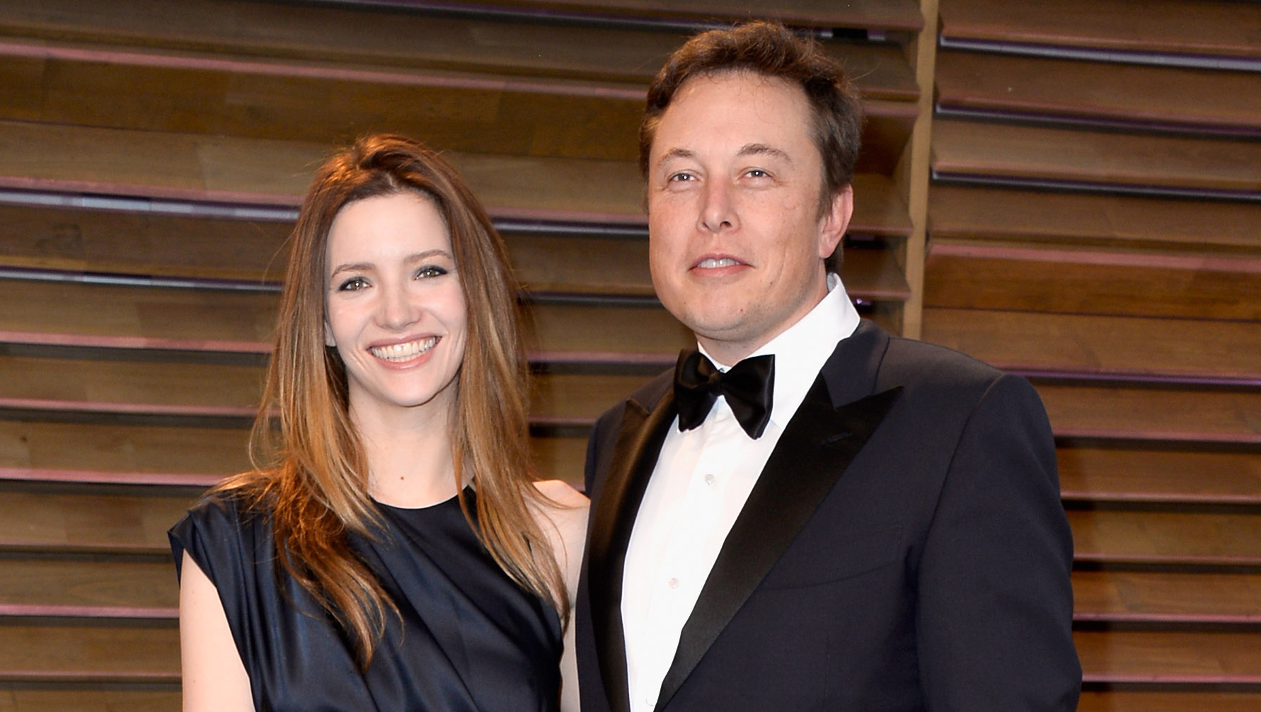 Elon Musk's ex-wife told his biographer that deep inside the Tesla CEO 'is  this manchild still standing in front of his father