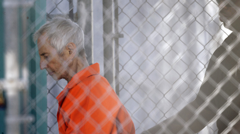 Robert Durst is escorted into Orleans Parish Prison after his arraignment in Orleans Parish Criminal District Court in New Orleans, Tuesday, March 17, 2015. 