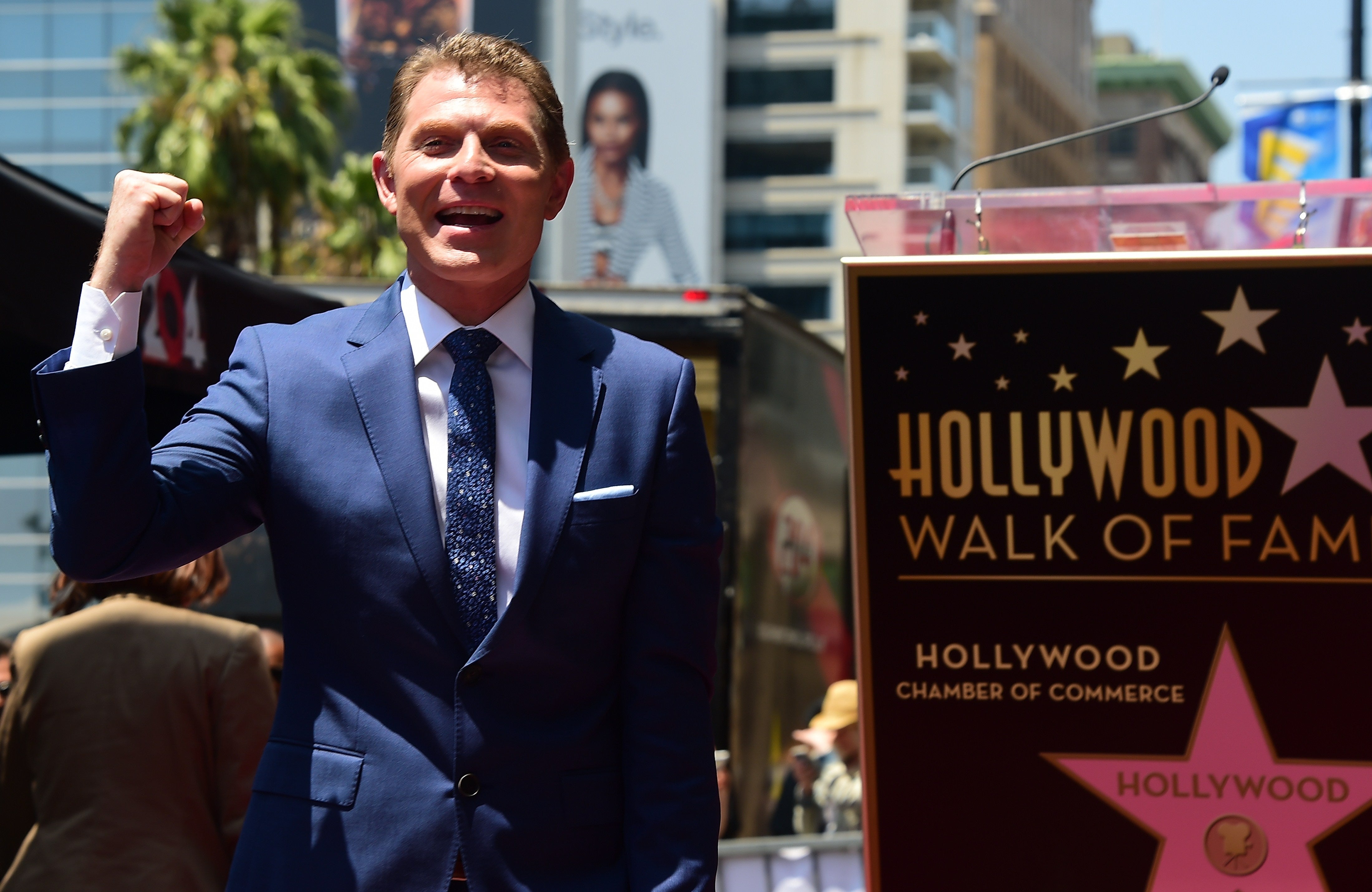 Bobby Flay gets Walk of Fame star as "cheater" banner flies overhead(00)