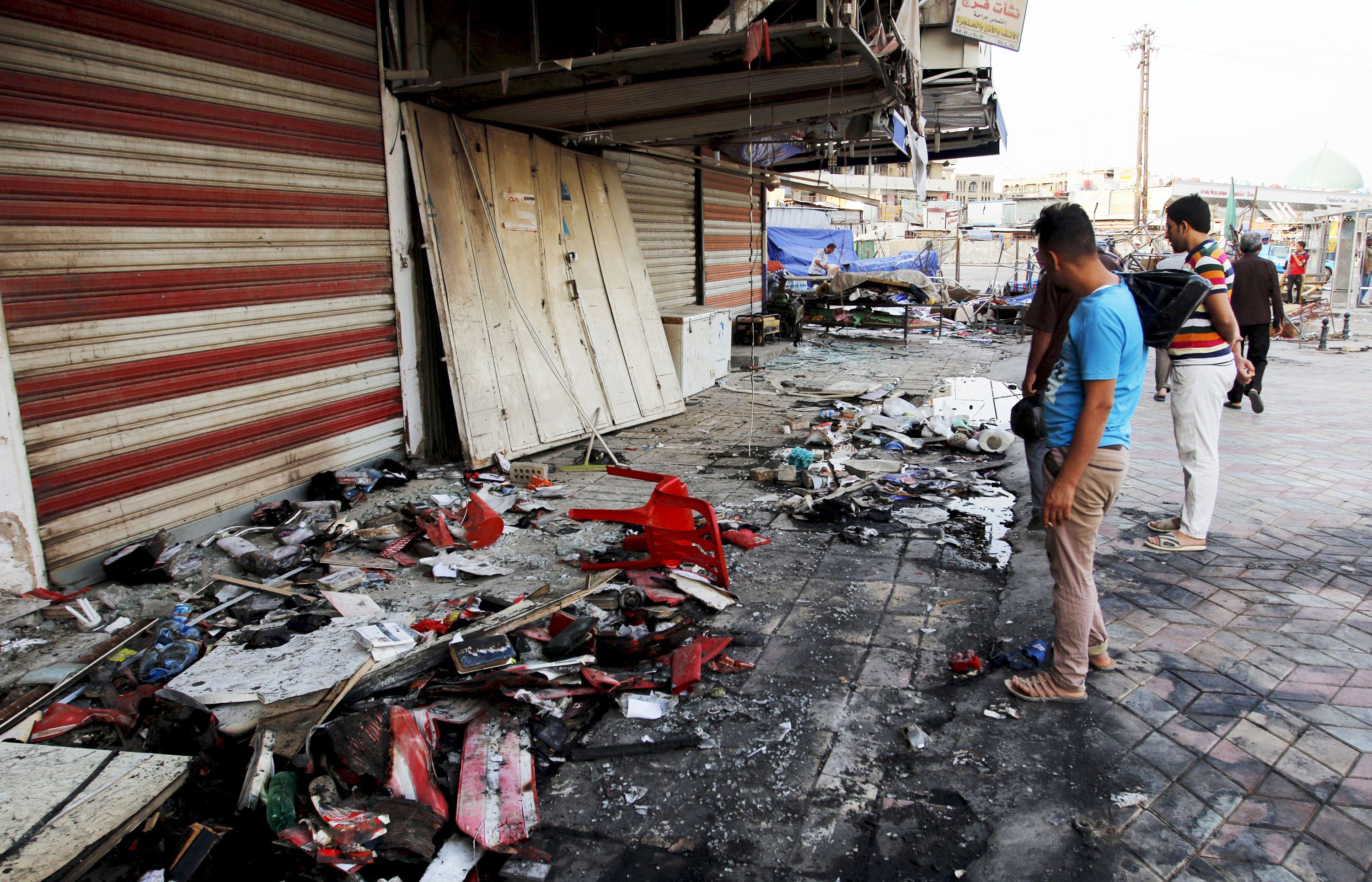 Car bomb blasts kill 26 in crowded Baghdad markets - CBS News