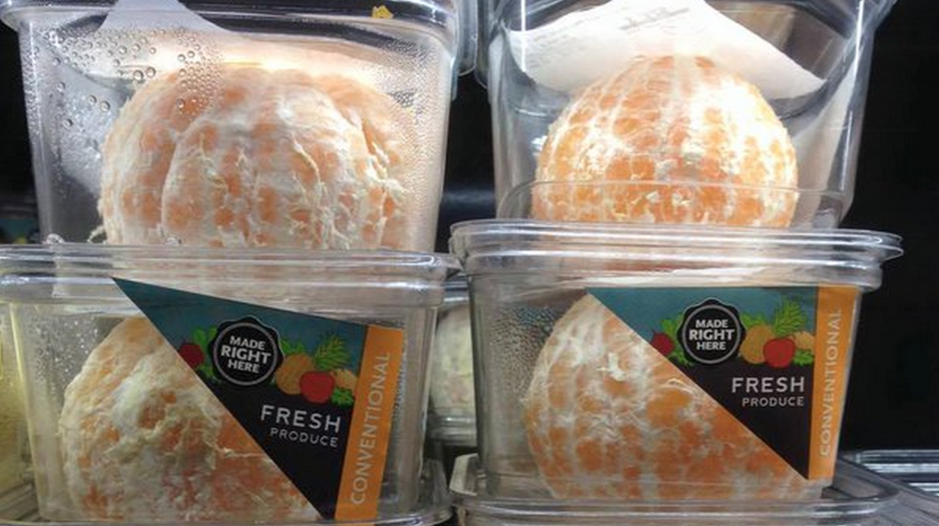 Fresh cut fruit in plastic take away containers a a Whole Foods in