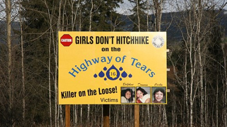 A warnign billboard along Canada's infamous Highway 16, dubbed the Highway of Tears 