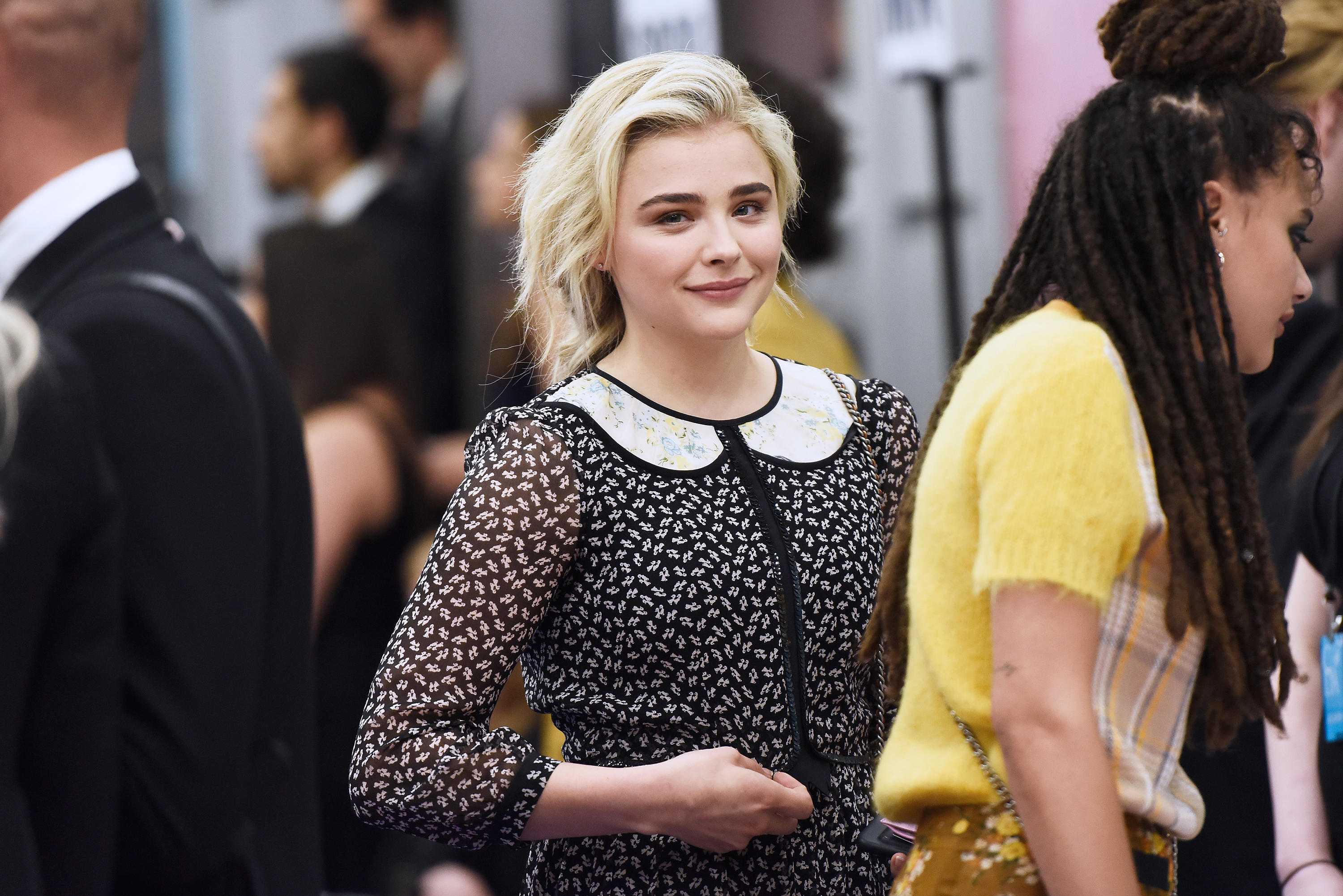 Chloe Grace Moretz catches a flight with her mom at Los Angeles