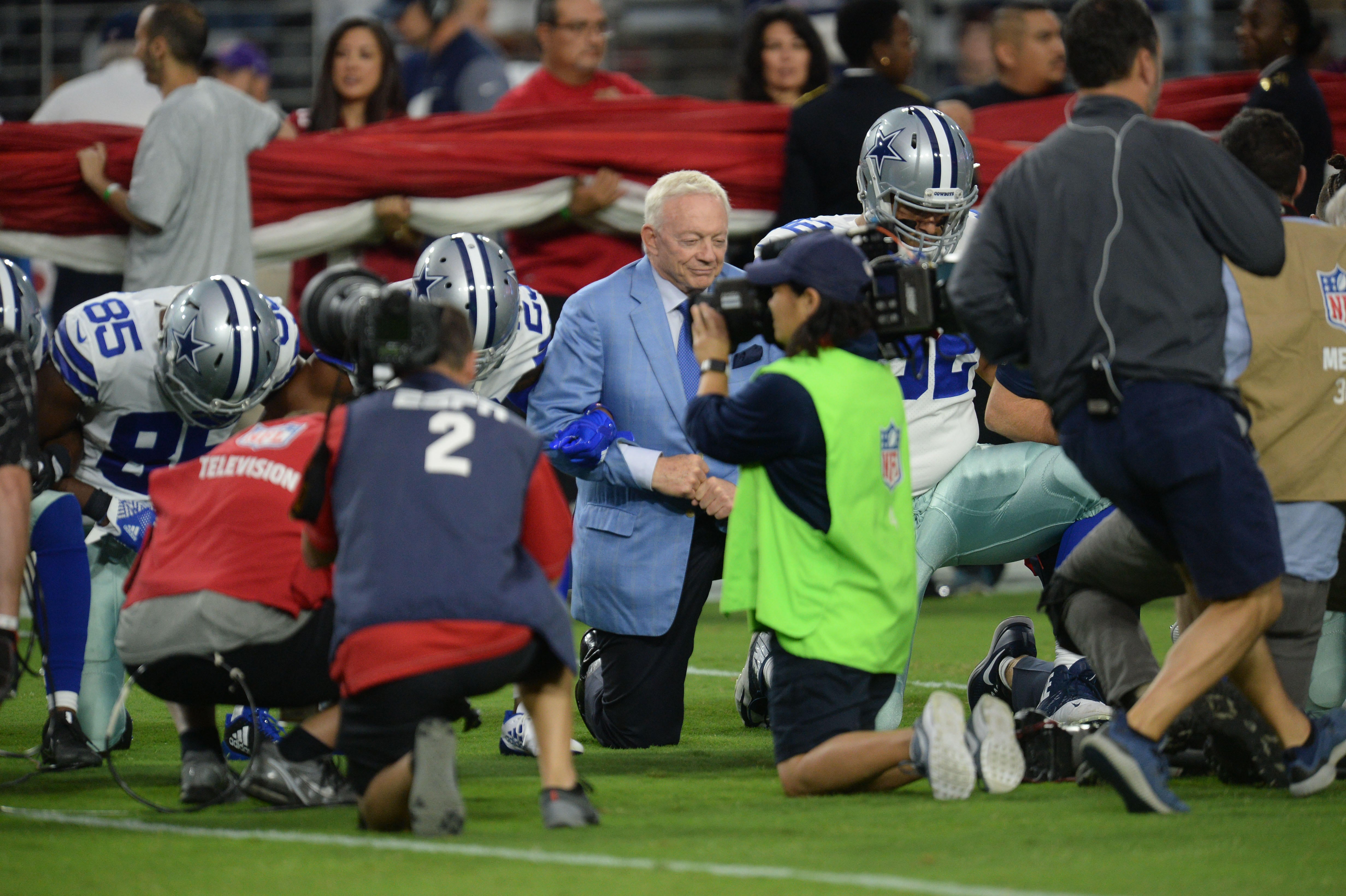 NFL players lock arms in national anthem at Cowboys-Cardinals game