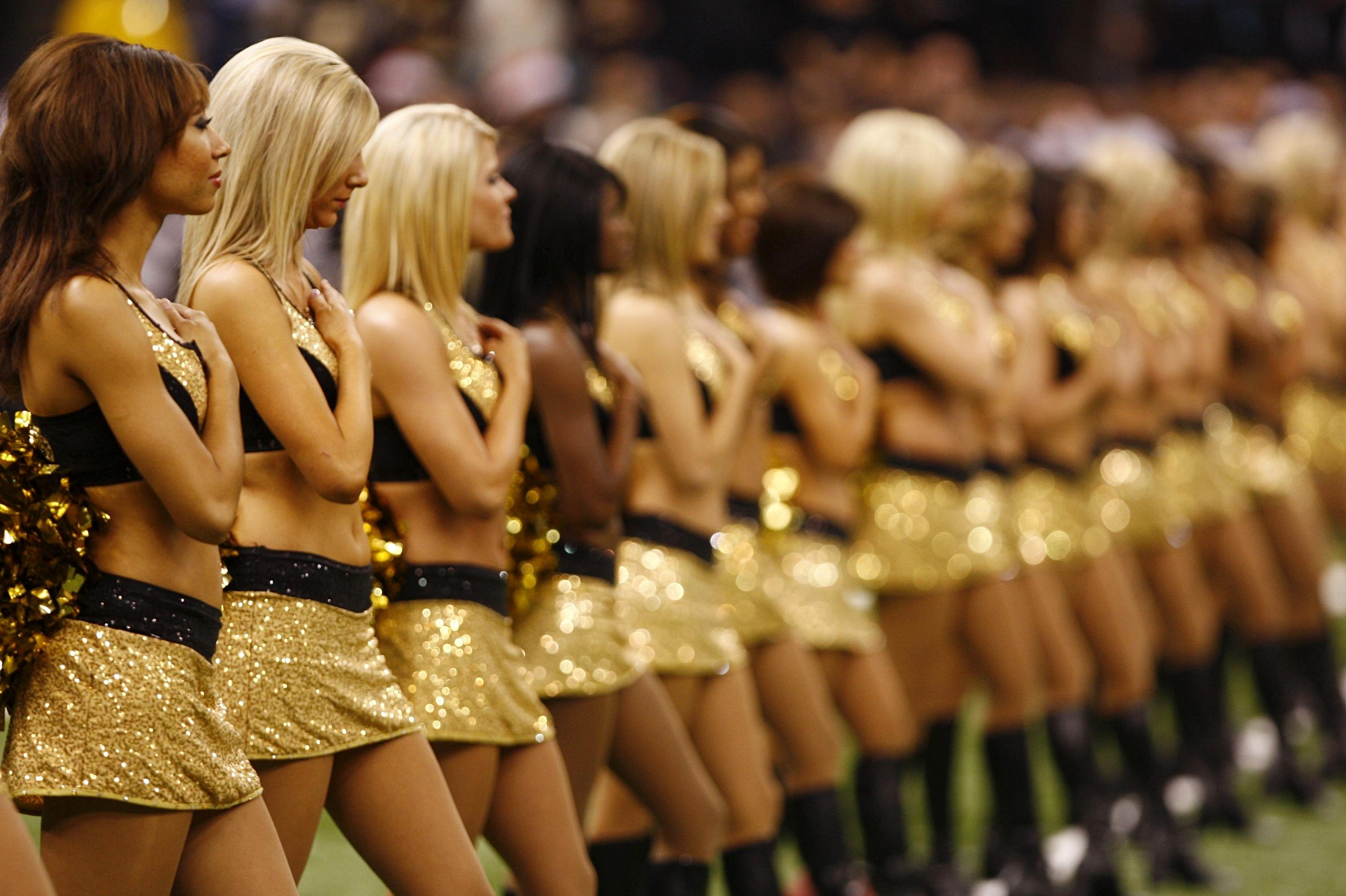 Bailey Davis, ex-New Orleans Saints cheerleader, says NFL team's policies  discriminate - CBS News