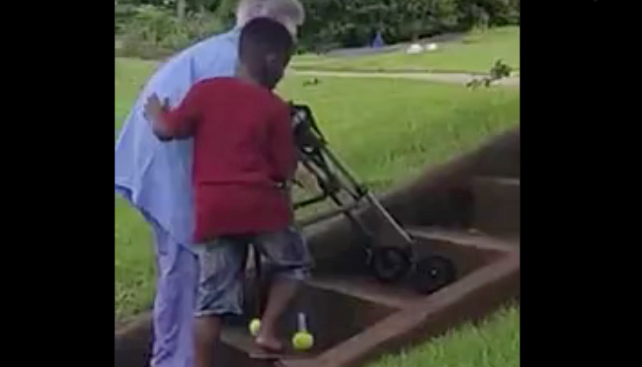 Video of little boy helping elderly woman struggling to walk up steps ...