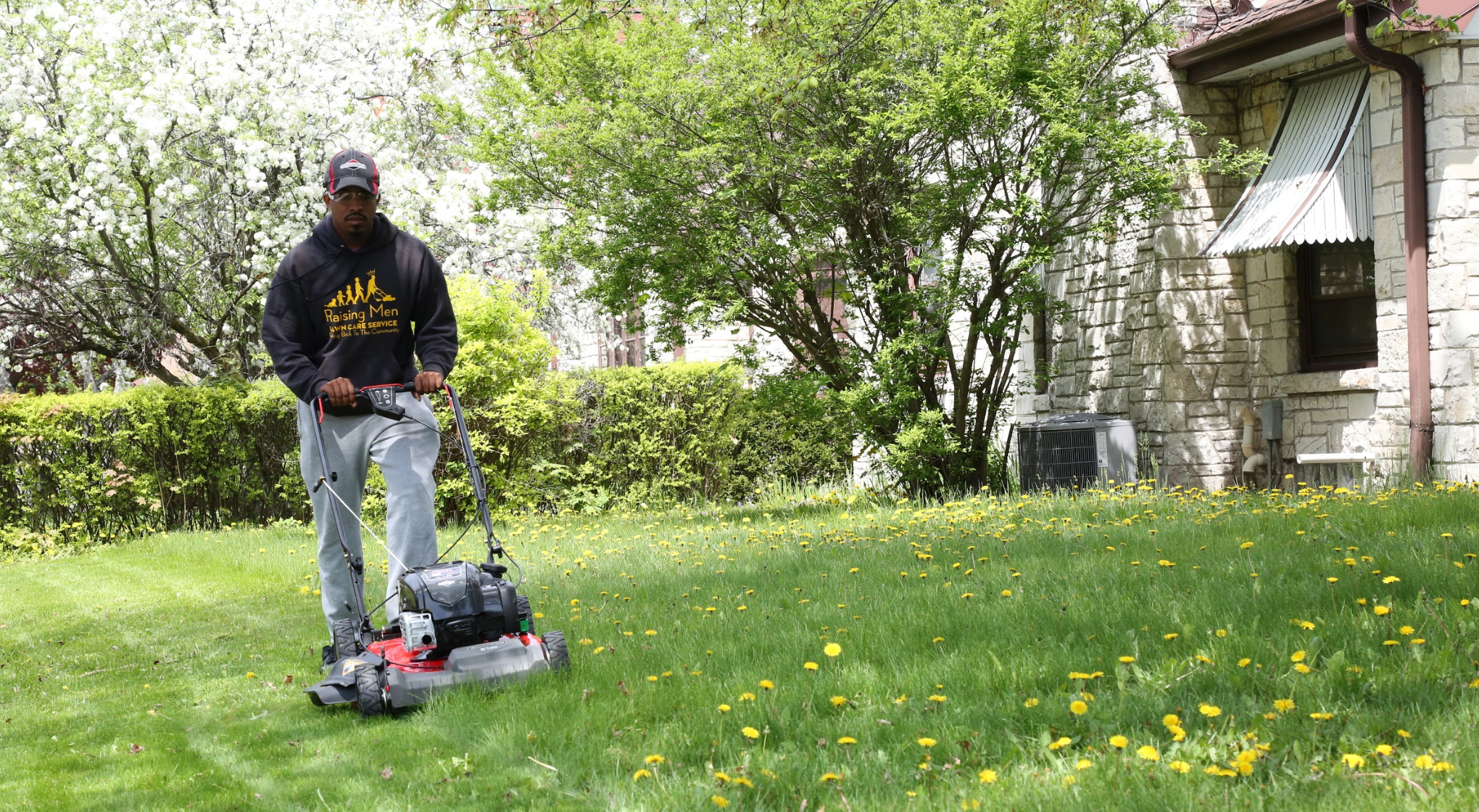 Image of person mowing their lawn