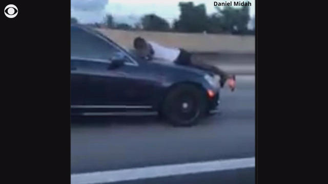 Man makes desperate 911 call while clinging to the hood of a speeding ...