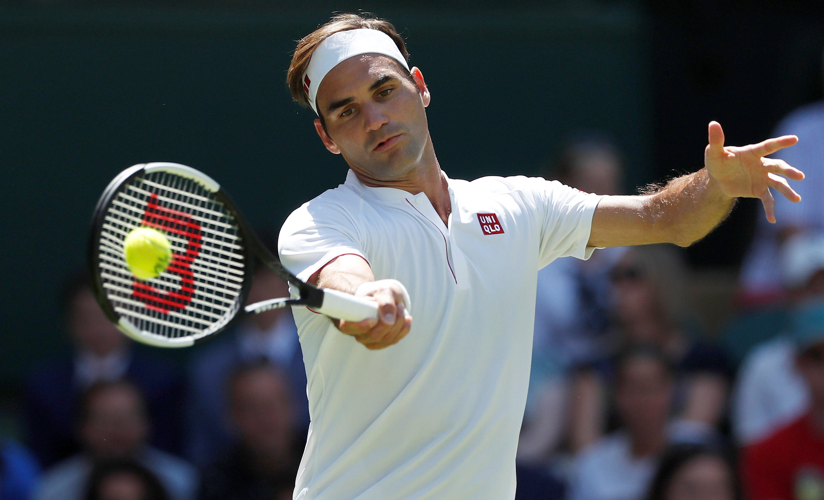 Roger Federer, Uniqlo partner at Wimbledon in reported $300 million deal -  CBS News