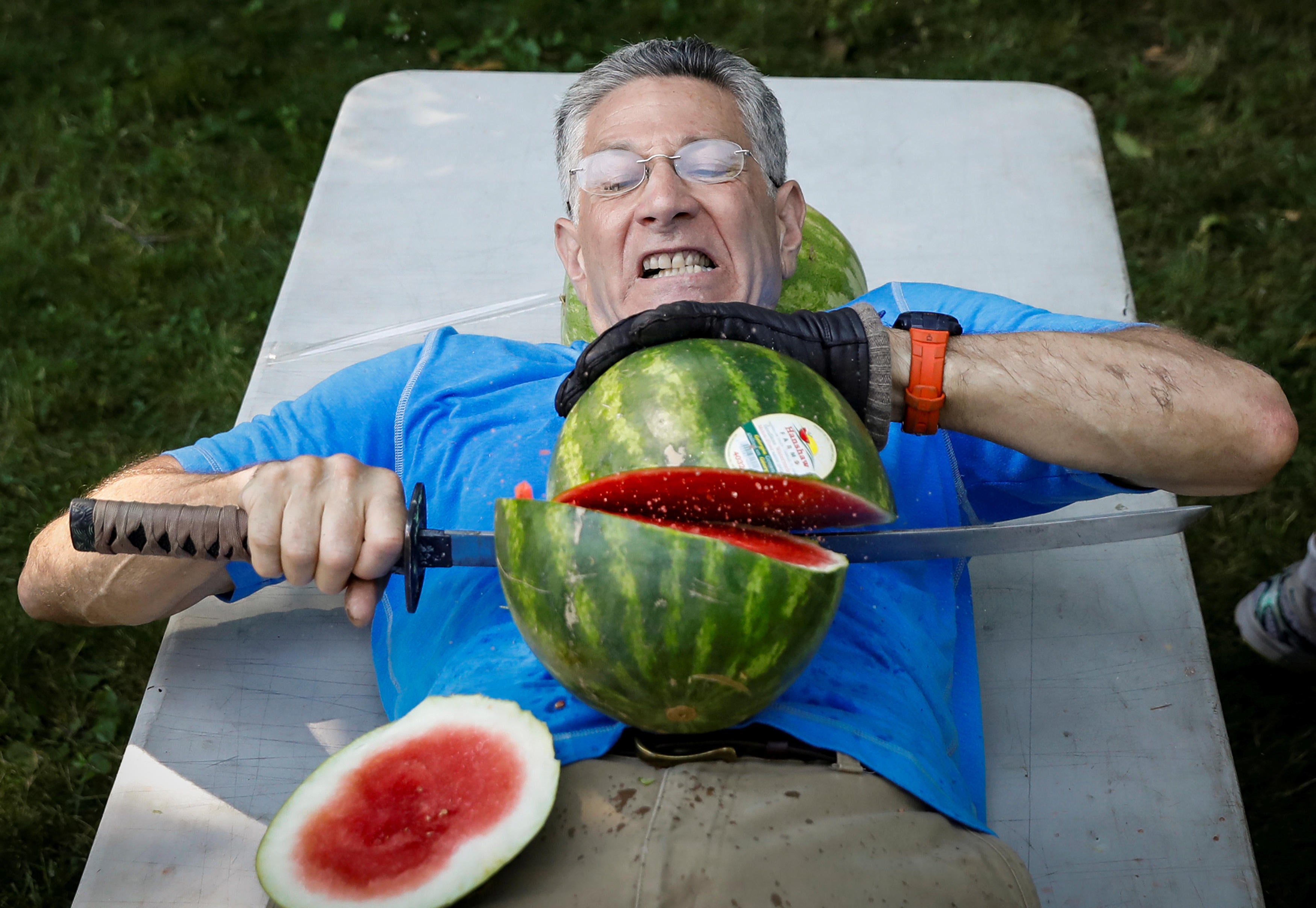 Man slices 27 watermelons in half on stomach, sets Guinness World