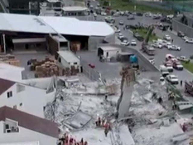 Seven dead and nine missing as three-story mall COLLAPSES while