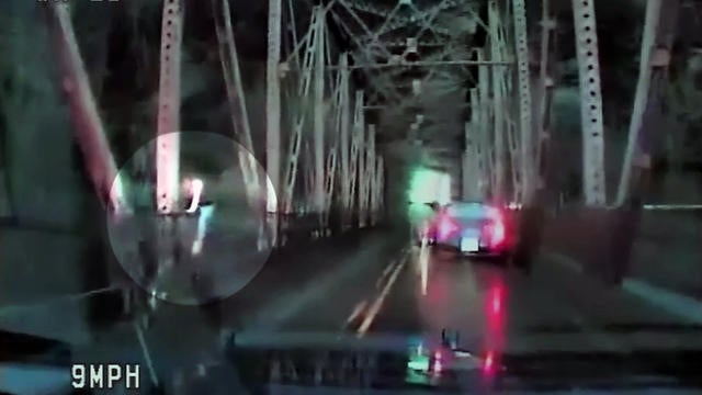 VIDEO: Woman jumps off bridge in an attempt to flee police - CBS News