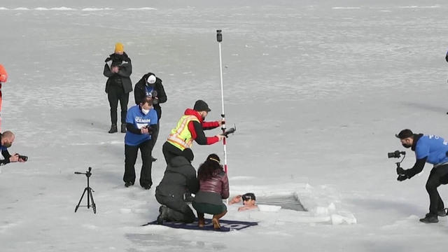 Free-diver breaks world record for longest swim under ice - CBS News