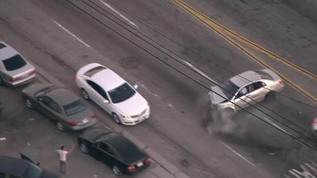 Armed man leads L.A. police on violent car chase - CBS News