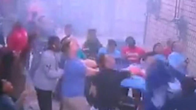 Watch: Mother throws children from window of burning building - CBS News