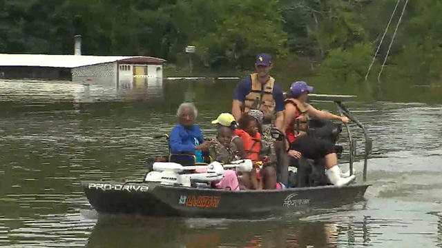 Tens of thousands rescued from historic Louisiana flooding - CBS News