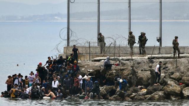 Dramatic photo shows rescue of baby girl born at sea on migrant ship ...