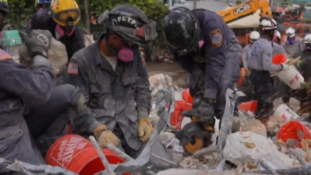 Search and rescue on pause at partially collapsed condo as crews ...