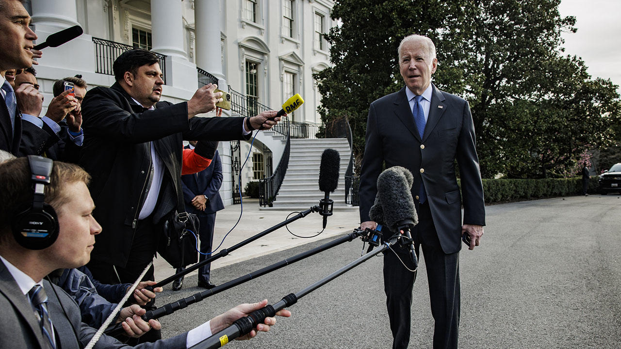 President Biden talks to reporters outside the White House 