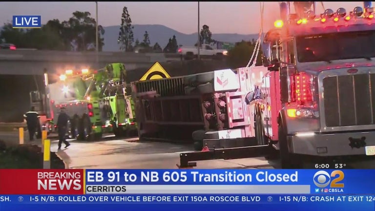 Big rig on its side blocks freeway transition road in Cerritos for ...