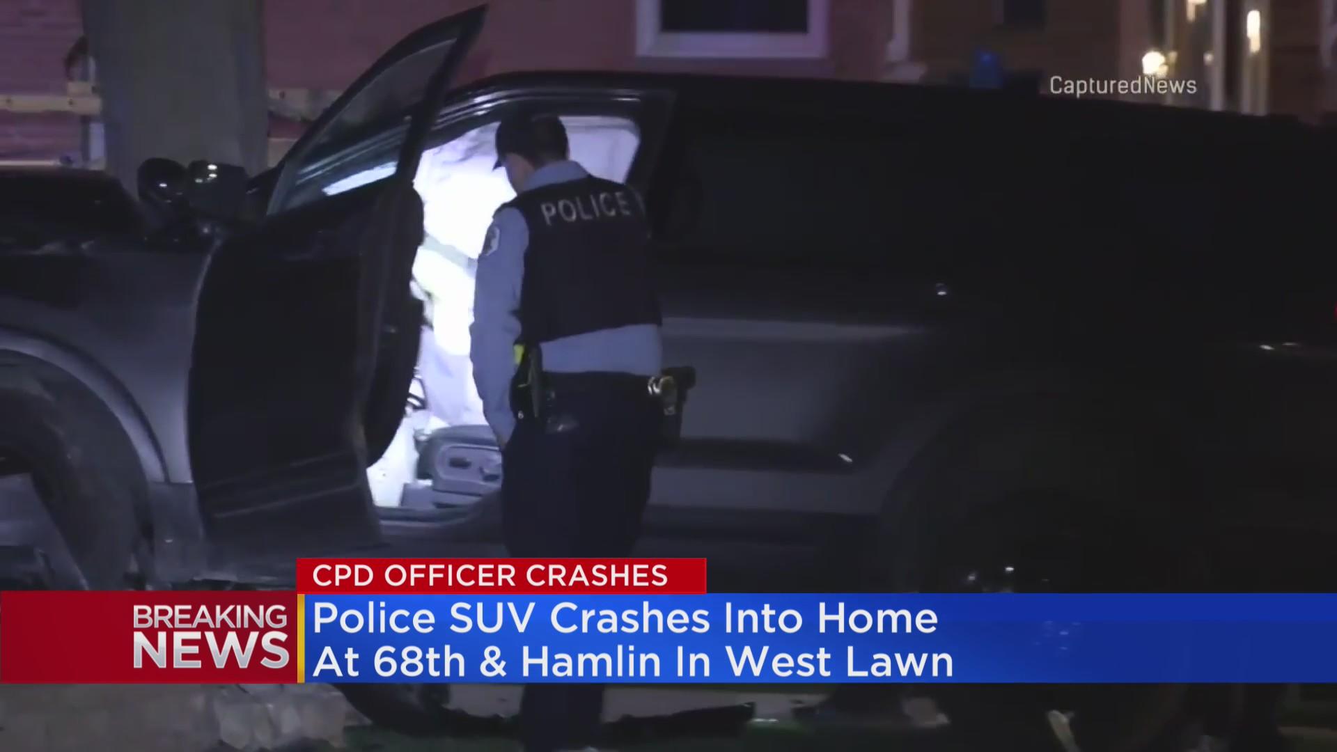 Chicago Police squad car crashes into home after collision with ...