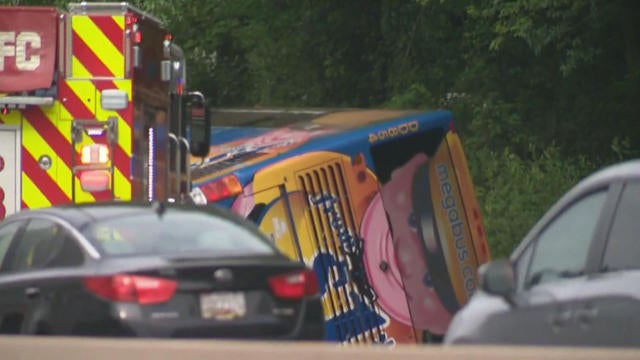 Bus rolls onto its side in Maryland, injuring 27 - CBS News
