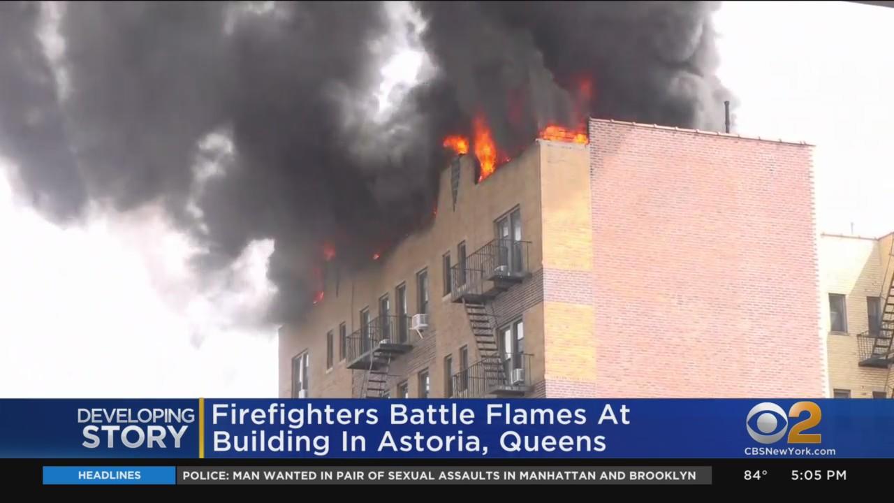 Firefighters battle massive fire at building in Astoria - CBS New York