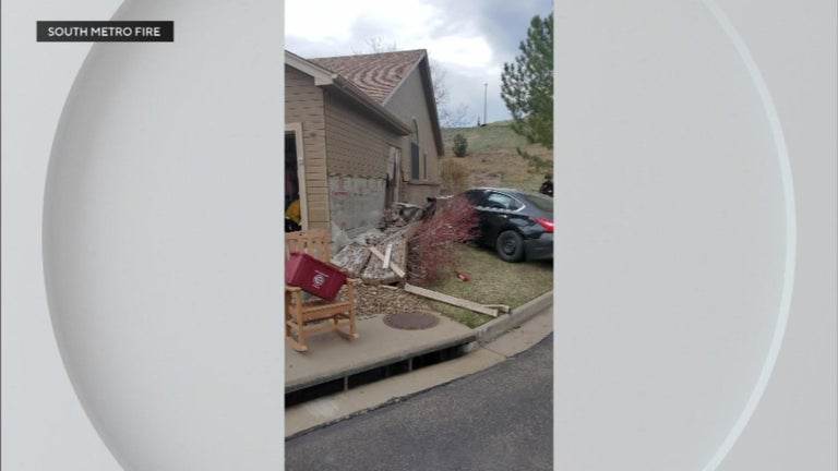 Driver hospitalized after crashing into garage in Lakewood - CBS Colorado