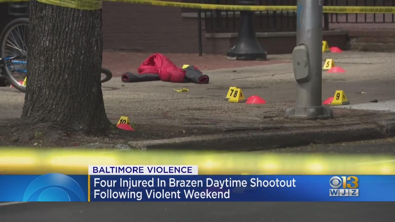 Four injured in brazen Charles Street shootout following violent ...