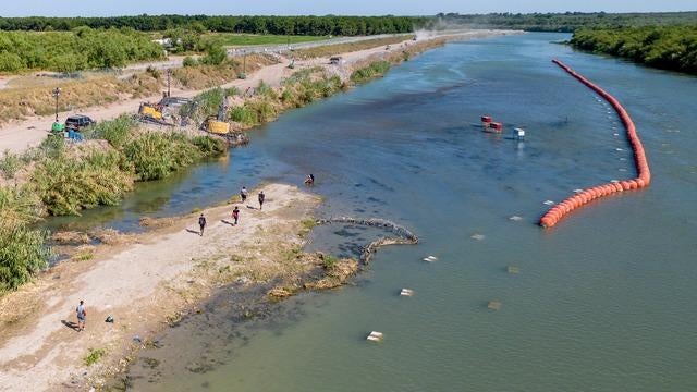 Justice Department threatens to sue Texas over floating border barriers ...