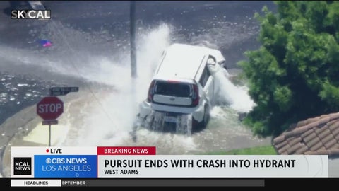 Stolen vehicle pursuit ends after suspect crashes into hydrant - CBS ...