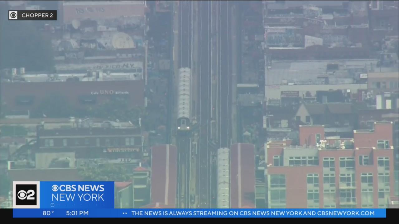 NYPD: Woman pushed onto subway tracks in Queens - CBS New York