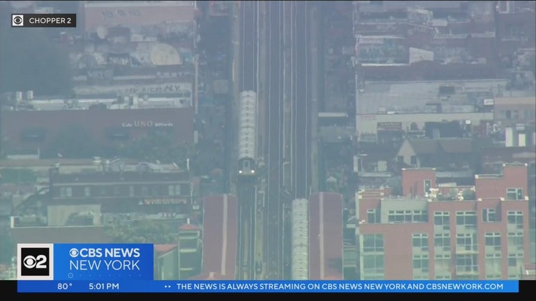 NYPD: Woman pushed onto subway tracks in Queens - CBS New York