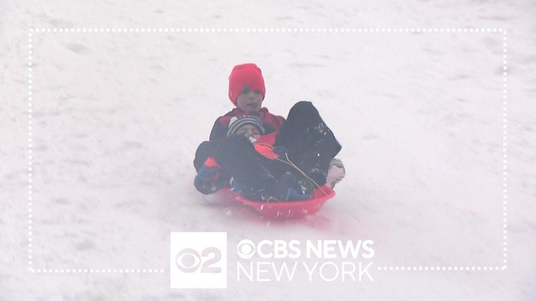 Crews work to clear Long Island roads while children enjoy a snow day ...
