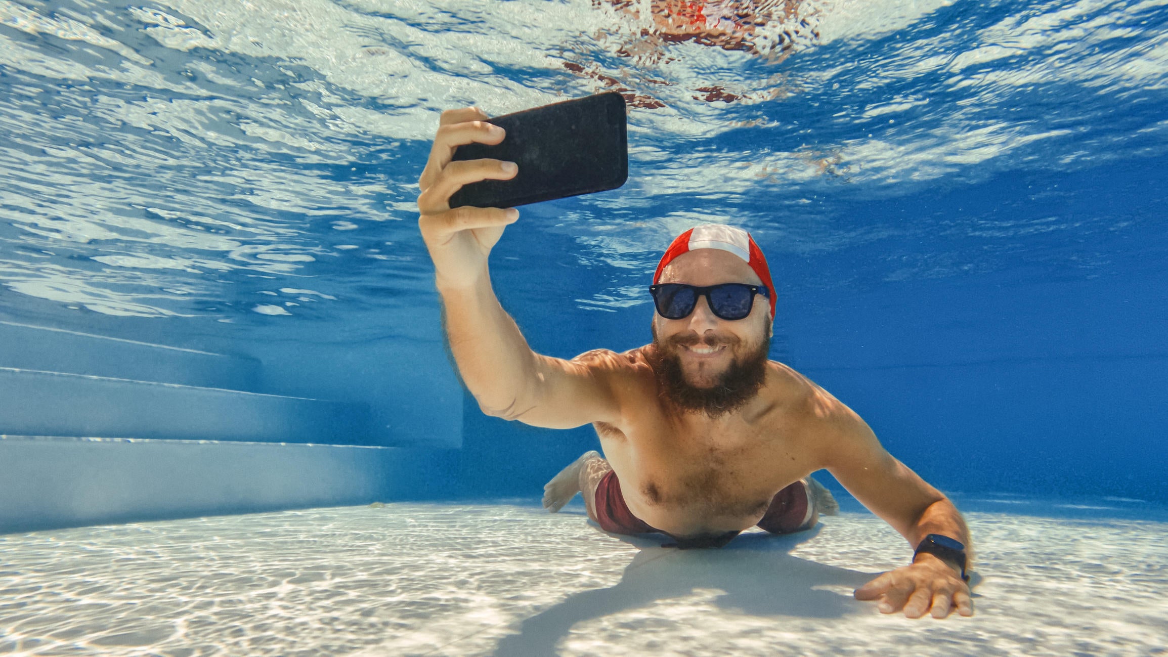 Man taking a photo underwater