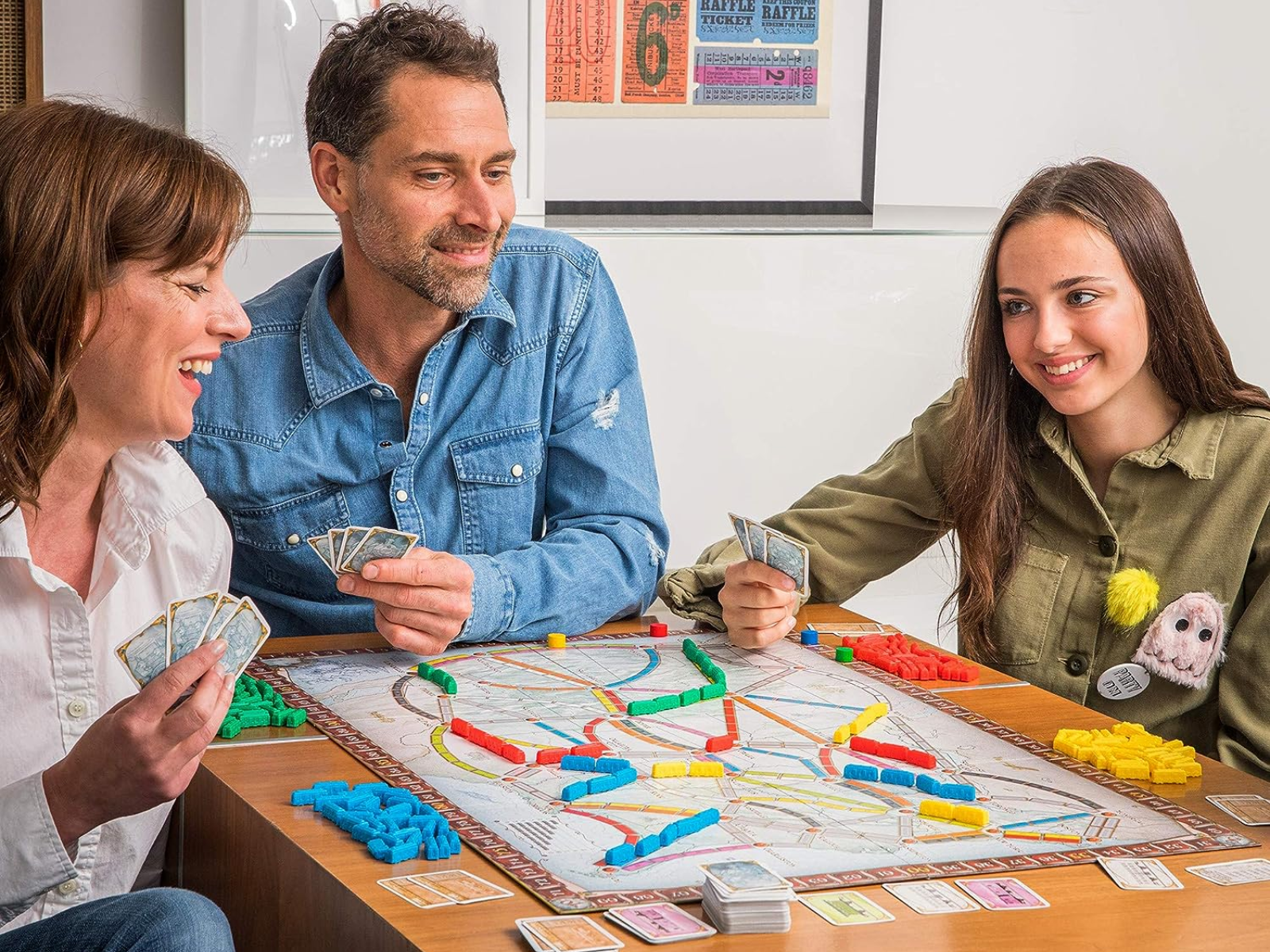 Family playing Ticket to Ride 