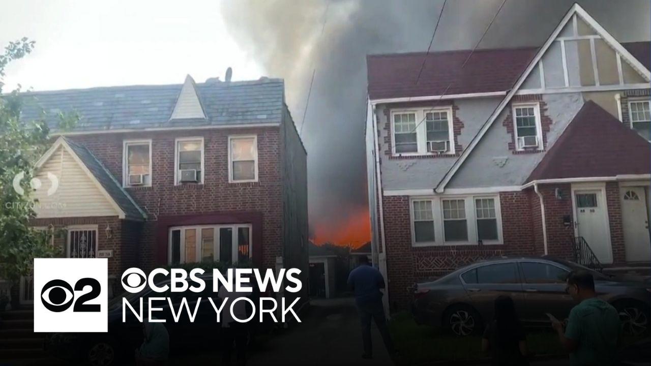 14 injured as fire spreads to multiple buildings in Queens - CBS New York