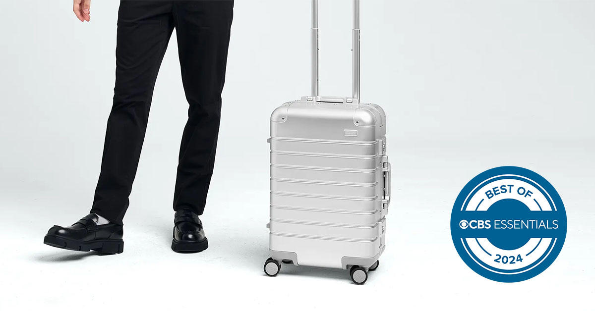 Man pulling aluminum luggage 