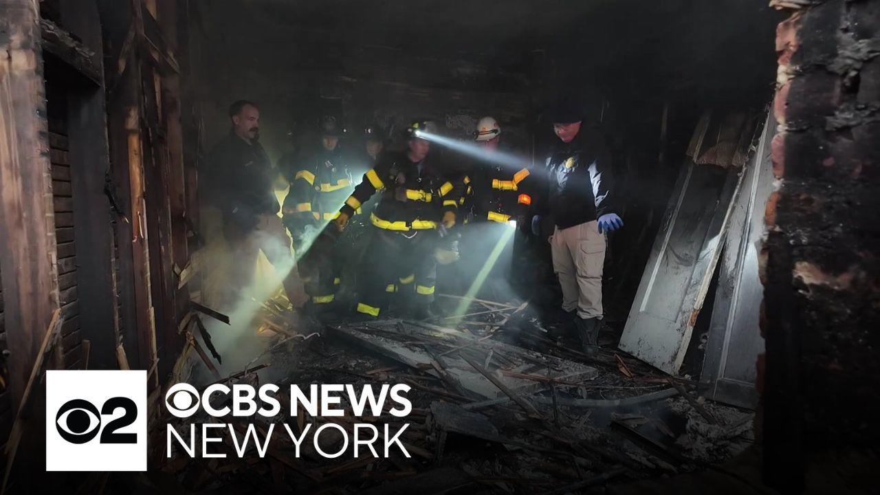Photos capture rescue of child from Inwood apartment fire in NYC - CBS ...